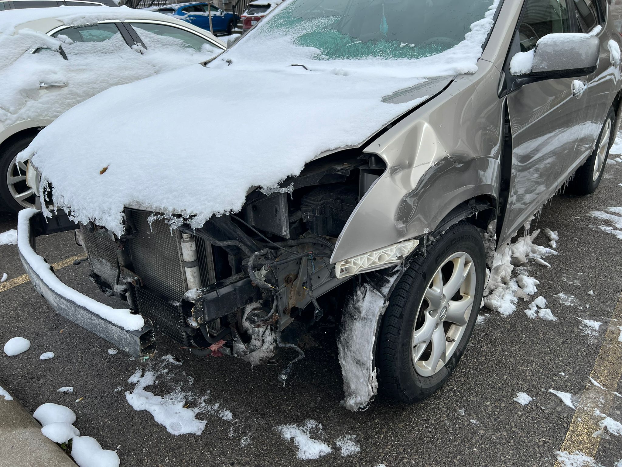 Severe front bumper damage and collision repair needed on car in Burlington Ontario
