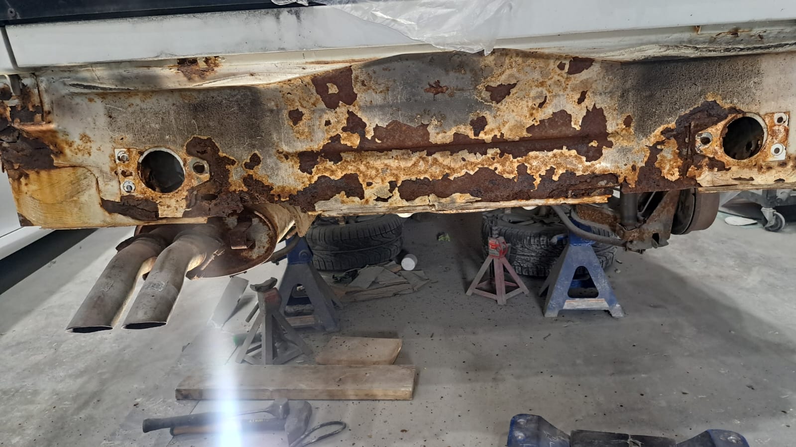 Severe car rust damage on undercarriage and rocker panel at Auto Home Inc Burlington Ontario